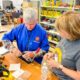 Two people work on a woodworking project at The Rivet in State College.